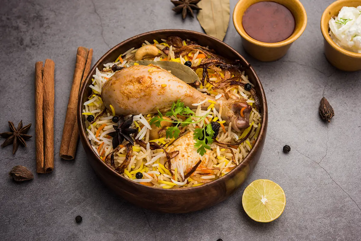 Chicken Biryani in a bowl with rice and cilantro.