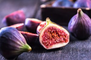 whole and cut fresh purple figs